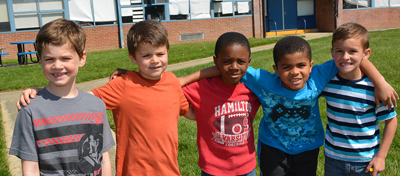 GPA Elementary student friends with arms around each others