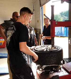 Dan working on his mechanic skills at Garfield Park Academy's on-campus garage