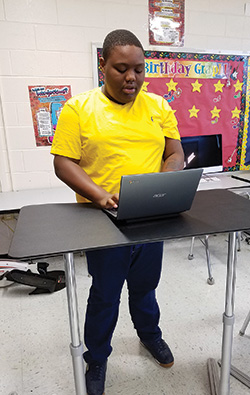 Student using standing desk at Willingboro NJ Private special education school