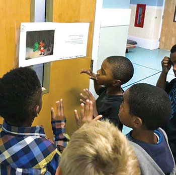 GPA elementary students on a Storywalk throughout the school