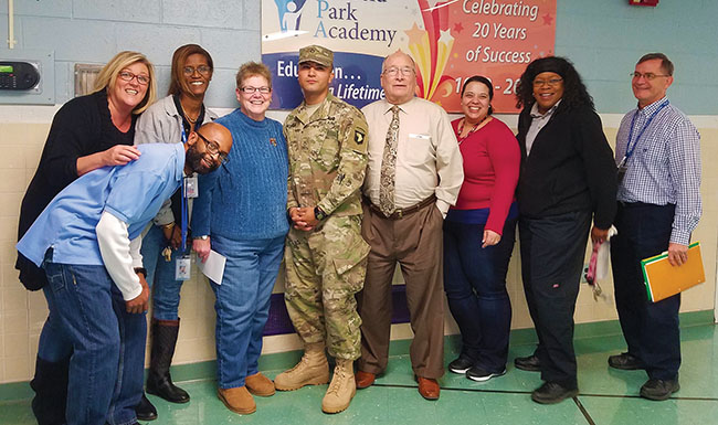 Jonathan Noriega '12 with GPA staff members during his visit