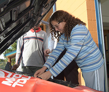 Female GPA student working in vocational auto program - private special education school in Willingboro NJ