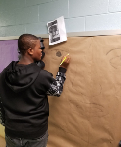 GPA student working on our new Cosmetology bulletin board