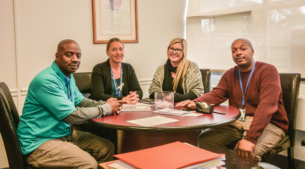 GPA faculty group at conference table -special group leaders