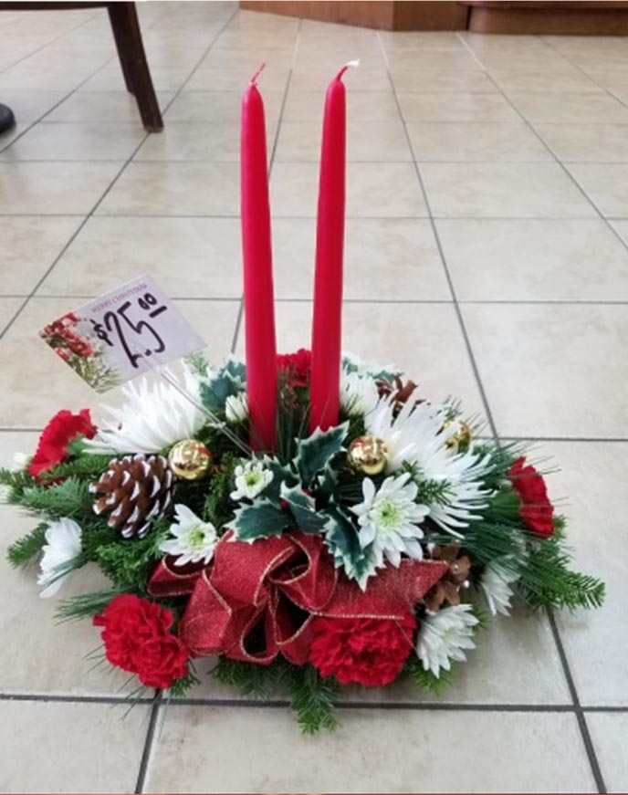 Holiday Centerpieces - Small $15 - Large $25 A festive arrangement of red & white flowers & mixed evergreen foliages, festooned with holiday ribbons, cones, glass balls & topped with a candle for that holiday glow.