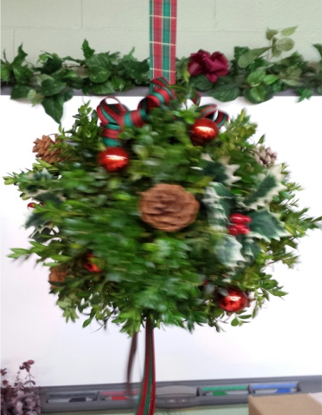 Boxwood Kissing ball - $25 A holiday favorite, a boxwood ball decorated wit cones, ornaments & festive ribbons.