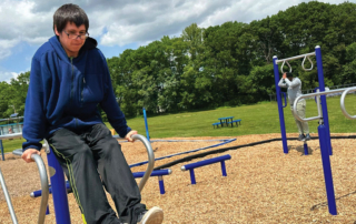 Male GPA middle school student working in the school's playground on physical wellness
