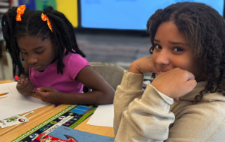 Two female GPA Elementary students working on reading and executive function skill building